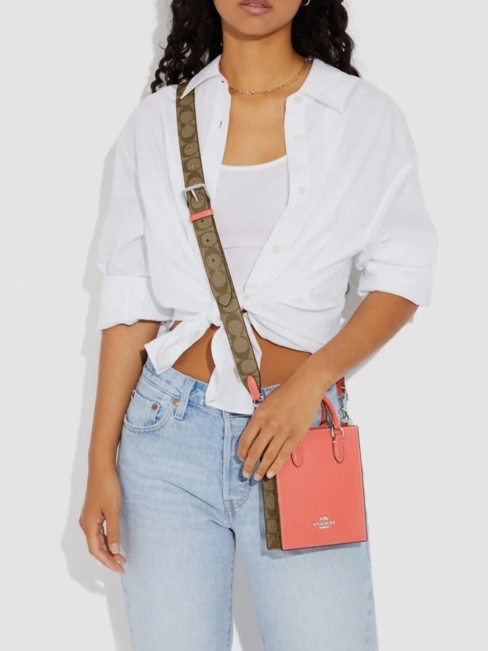 Coach Pebbled Leather Crossbody Phone Bag in Coral with Signature Strap